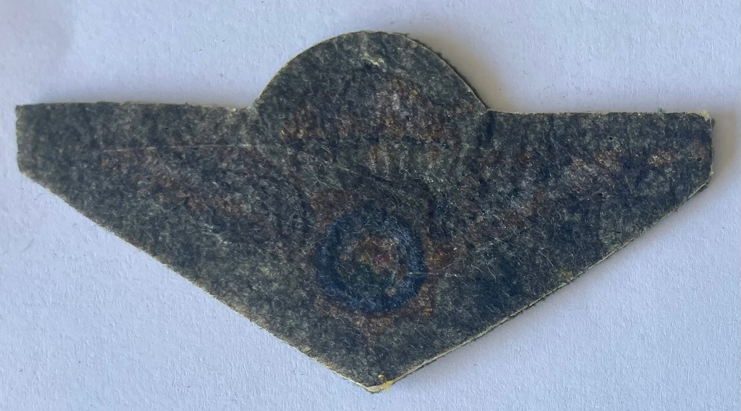 Decorative stone object with a central circular design on a white background