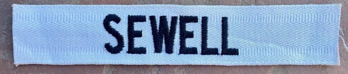 Vintage US Army Name Tape Black on White "Sewell" - Bateleur Militaria