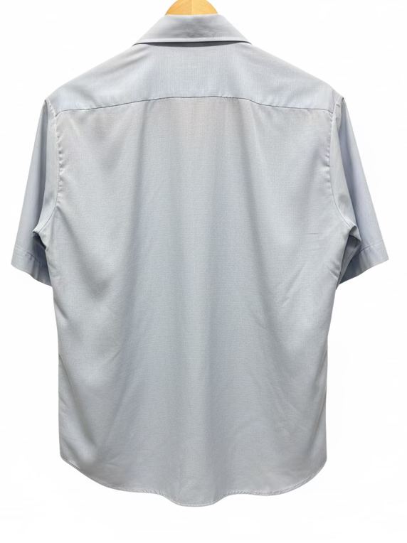 Light gray short-sleeve shirt on a hanger against a yellow wall.