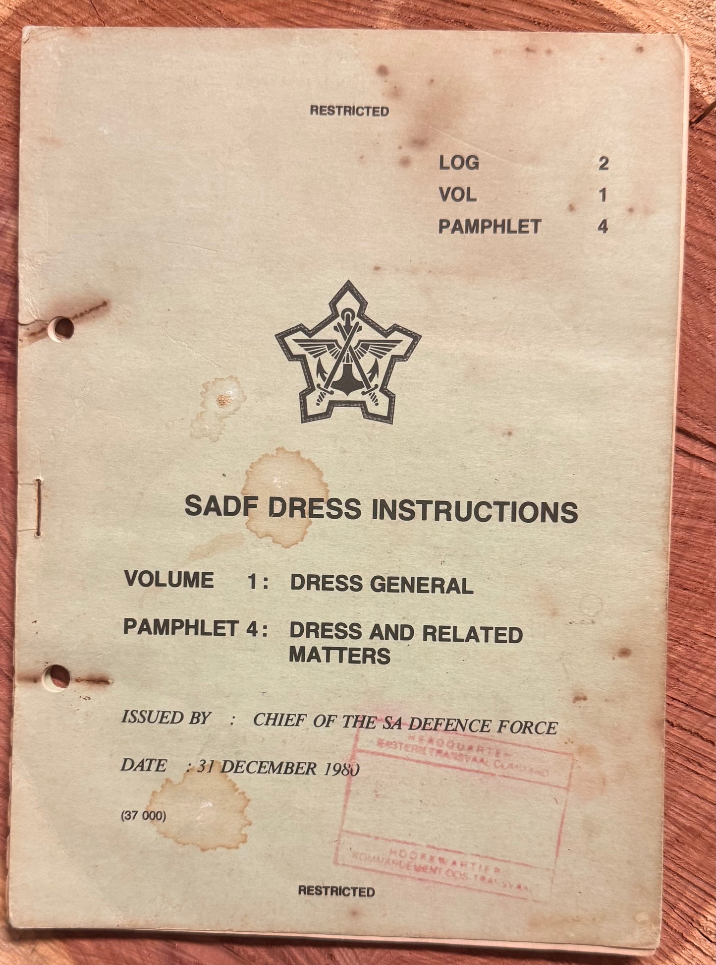 Vintage document titled 'SAF Dress Instructions' on a wooden surface