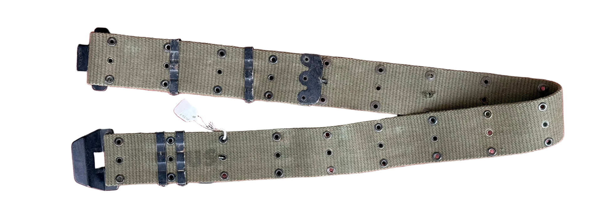 An olive green tactical web belt with black plastic buckles and metal eyelets, laid flat on a textured red surface.