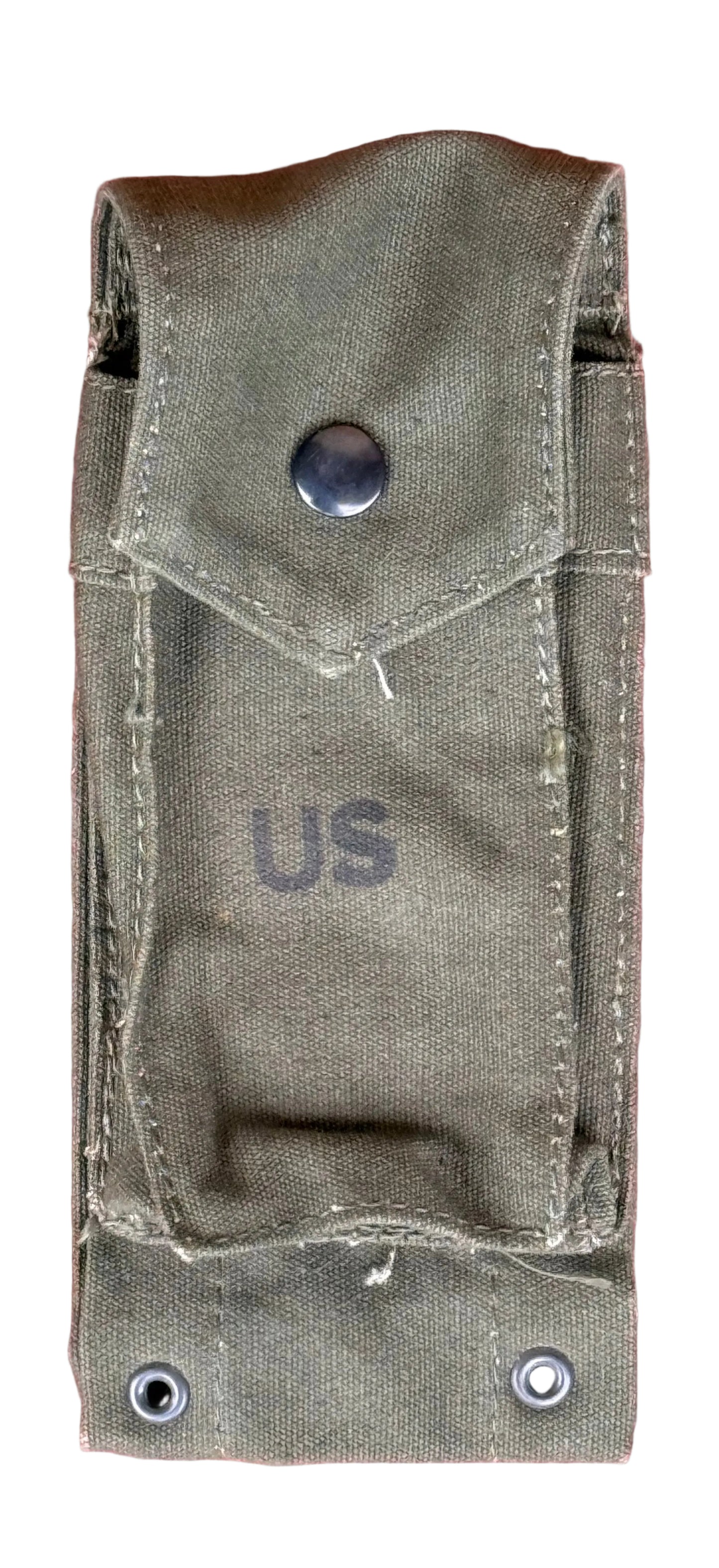 An olive drab canvas military pouch with a snap button closure and the letters 'US' printed on the front, shown against a textured pink background.