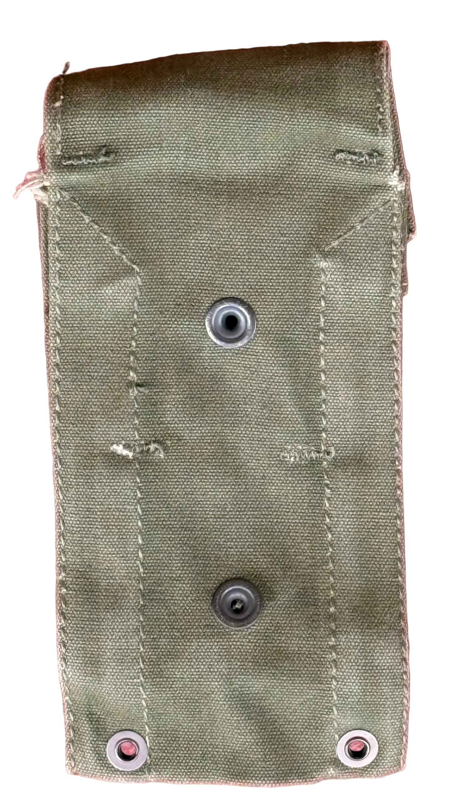 An olive green canvas utility pouch with metal grommets, laid flat on a textured red background.