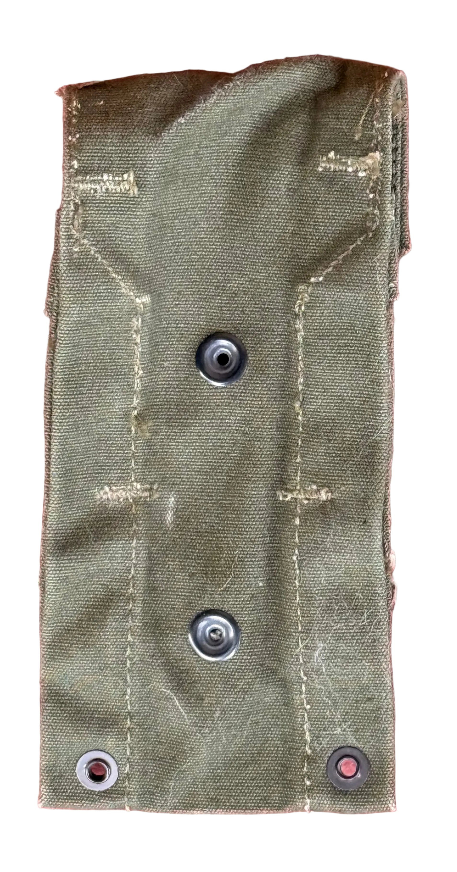 An olive drab canvas utility pouch with metal snap fasteners, shown flat against a textured red background.