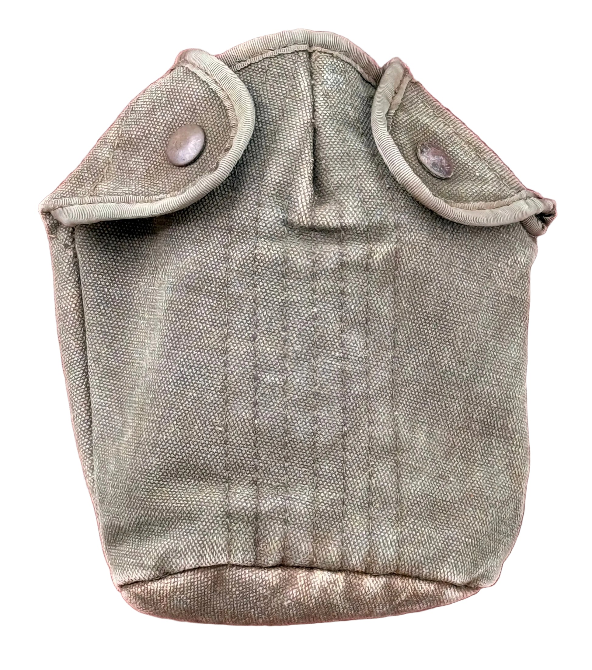 A vintage olive drab canvas canteen pouch with two buttoned flap pockets, shown against a textured red-pink background.