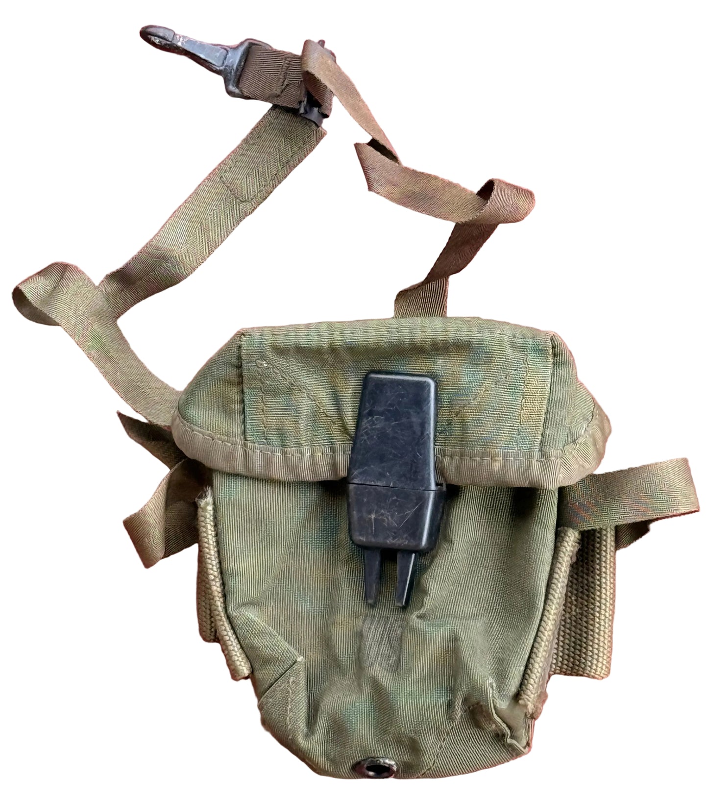 An olive drab tactical pouch with a black plastic clip or lock, laid flat on a textured pink background.