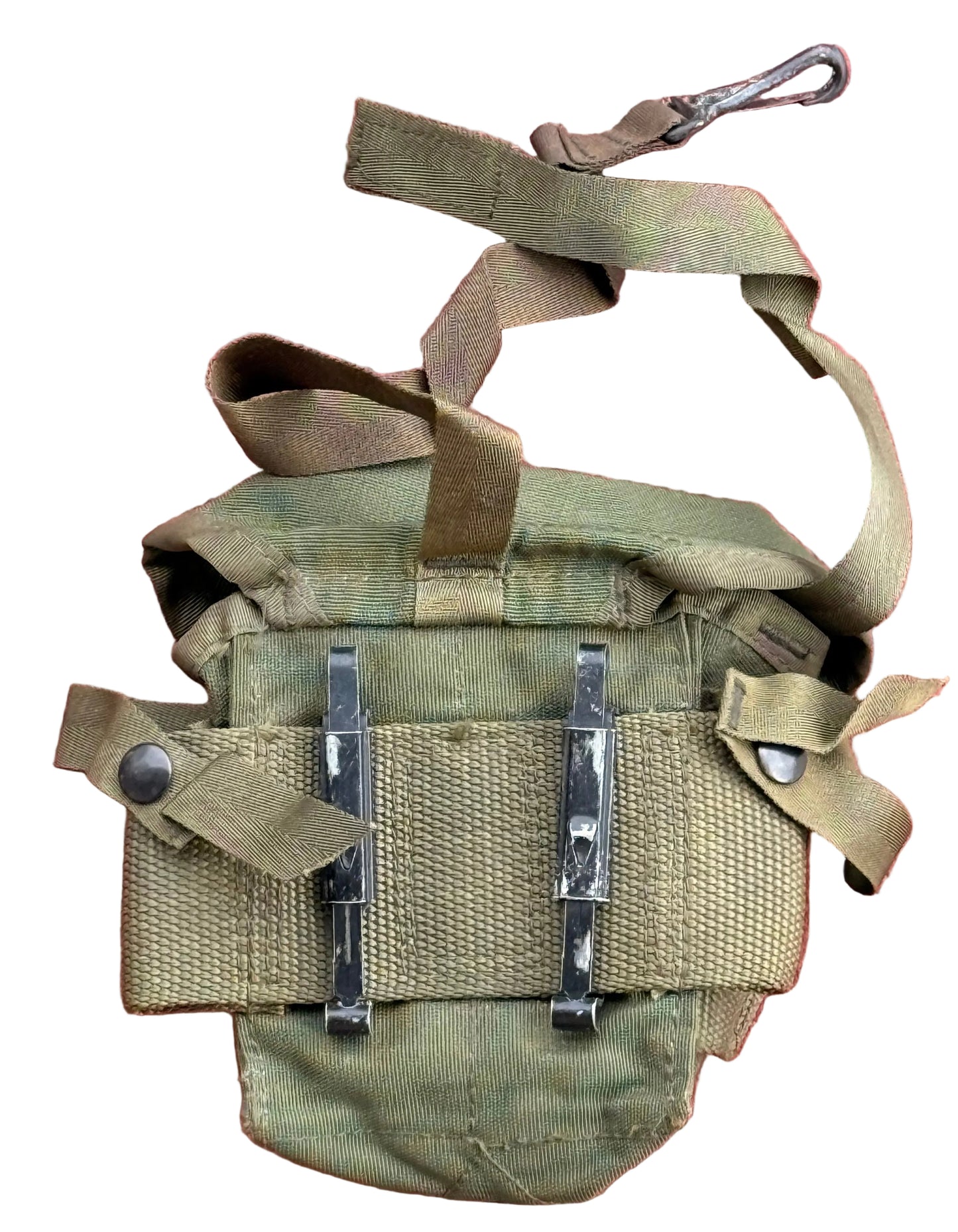 An olive drab tactical pouch with two black metal quick-release buckles and a matching webbing strap with a carabiner, laid flat on a textured red surface.