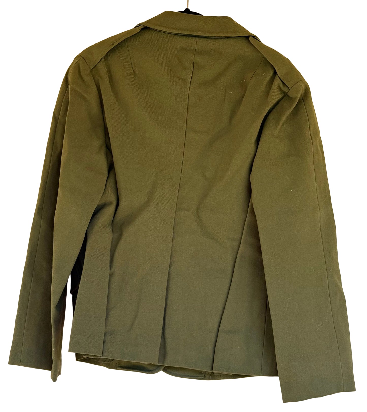 An olive green military-style jacket shown from the back, hanging on a black hanger against a plain beige wall.