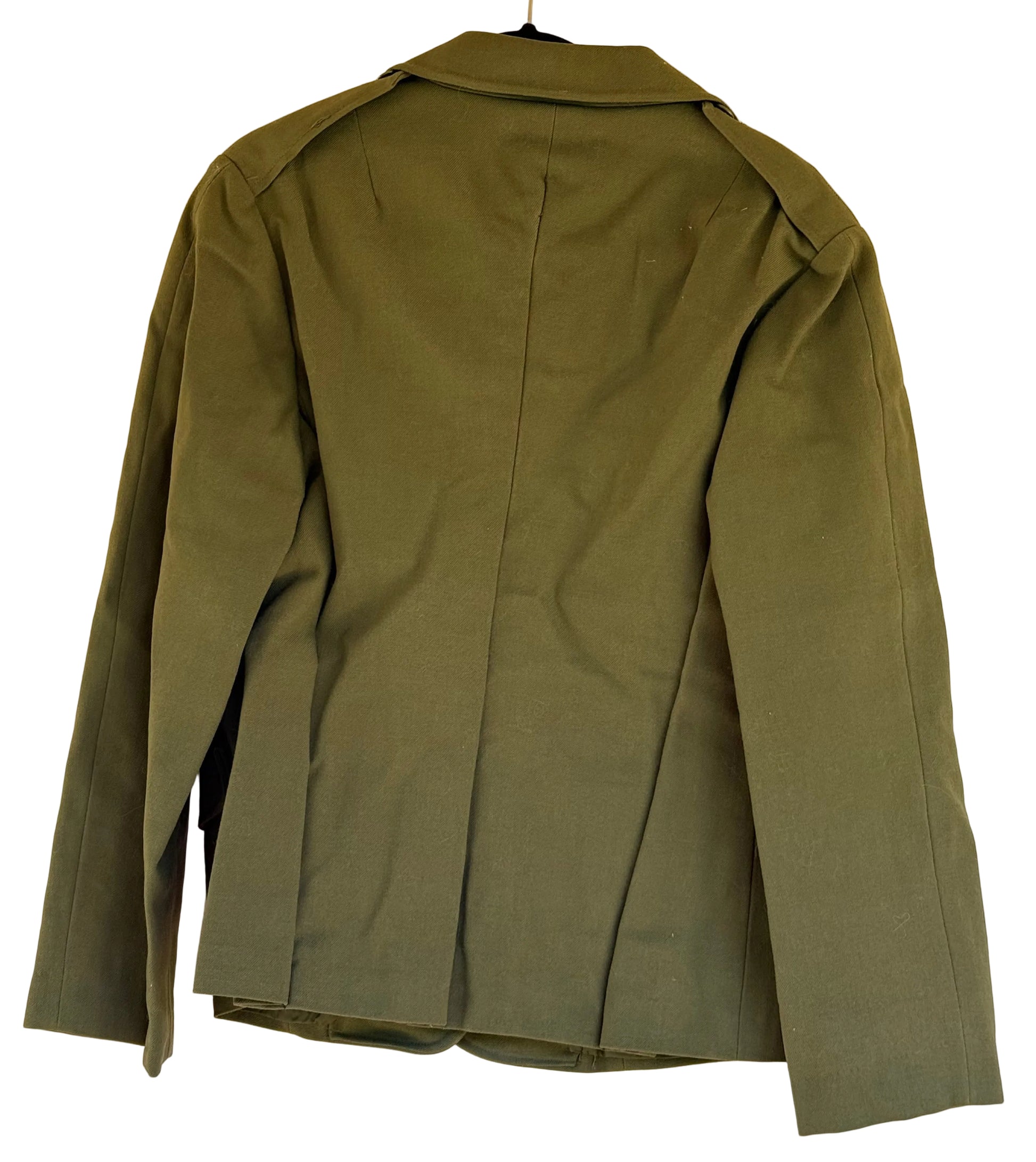 An olive green military-style jacket shown from the back, hanging on a black hanger against a plain beige wall.