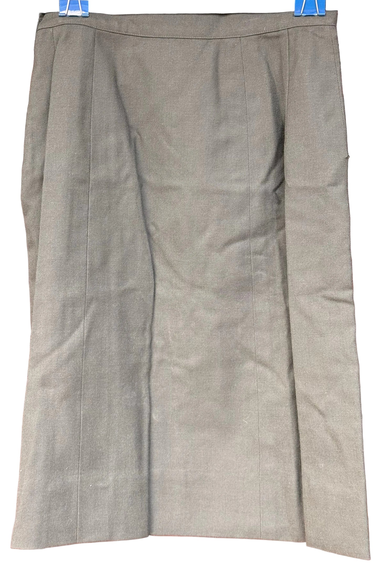 A knee-length olive green skirt with a subtle sheen, shown hanging flat against a dark wood background.