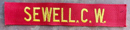 Vintage US Army Name Tape Yellow on Red "Sewell" - Bateleur Militaria